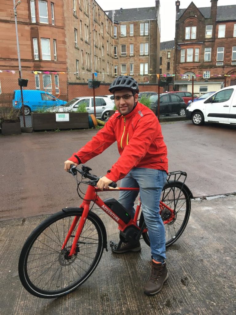 A photo of our intern riding his bike